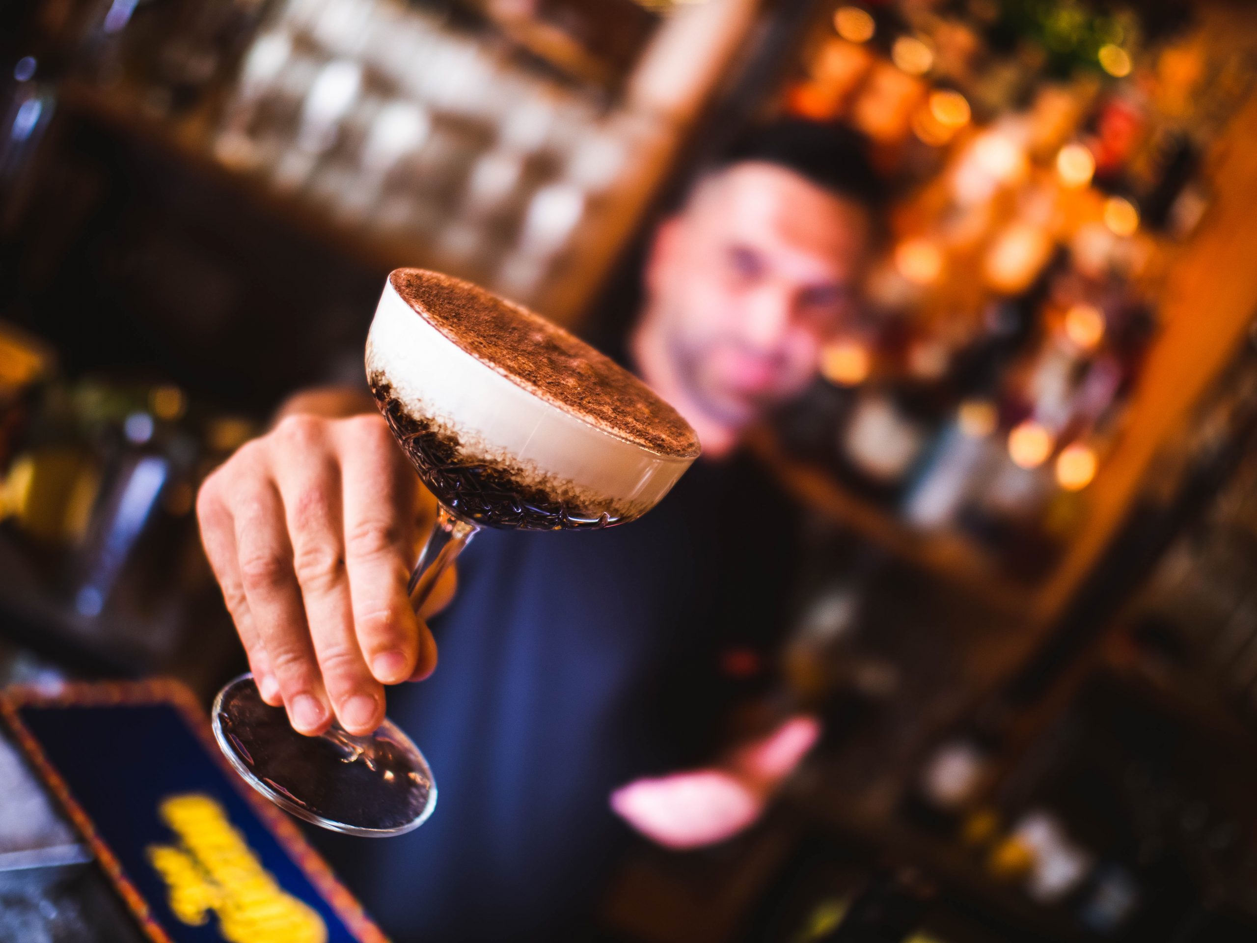 Bartender serving an espresso martini