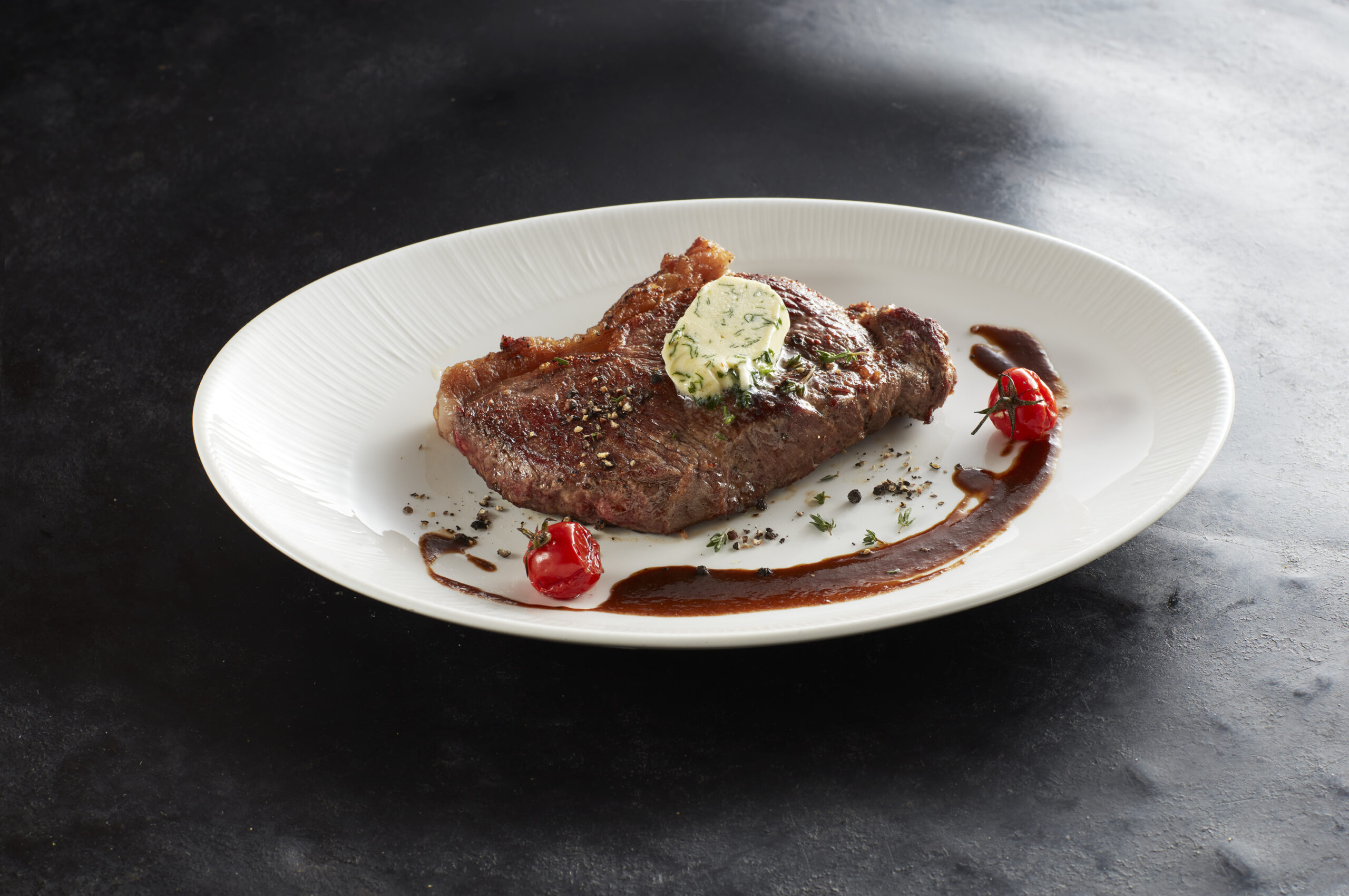Grilled steak with herb butter